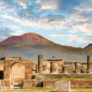 Ancient walls in Pompeii with volcano Vesuvius in the background