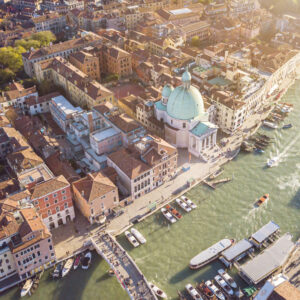 Drone Aerial view of iconic and unique Grand Canal crossing city of Venice with old tradition architecture as seen from above altitude