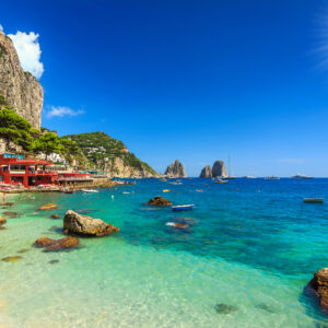 Faraglioni cliffs and wonderful beach in Capri island,Italy,Europe